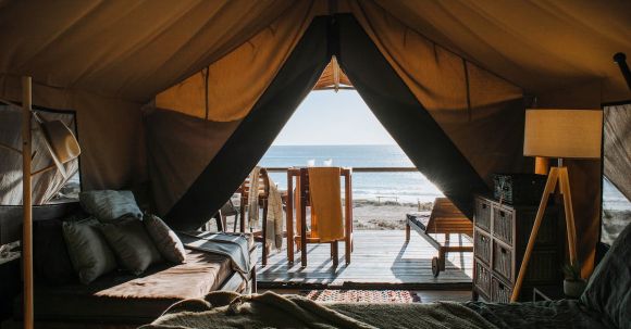 Accommodations - Cozy tent with bed and terrace on beach