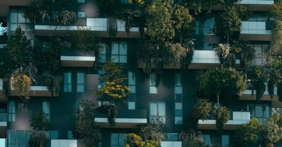 Accommodations - Modern residential building facade decorated with green plants
