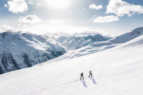Mountaineering - Two Man Hiking on Snow Mountain