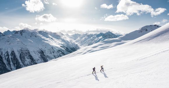 Mountaineering - Two Man Hiking on Snow Mountain