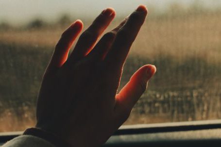 Car Journey - Hand on a Car Window