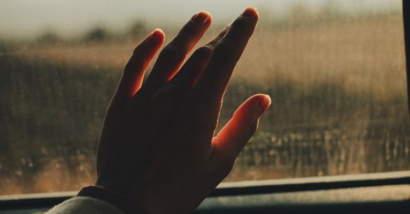Car Journey - Hand on a Car Window