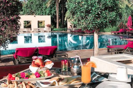 Luxury Travel - Foods Set on Table by the Pool