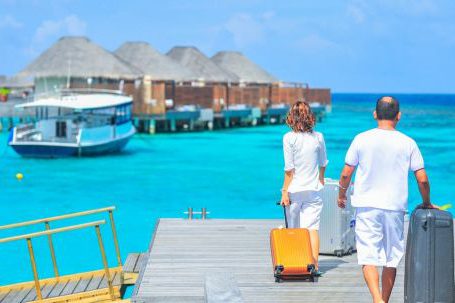 Luxury Travel - Man and Woman Walks on Dock