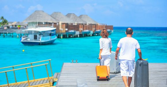 Luxury Travel - Man and Woman Walks on Dock