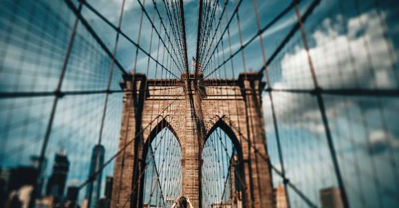 Sightseeing - Blur Photo of Brooklyn Bridge at Daytime