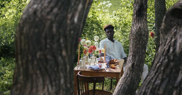 Solo Nature - A Man Sitting on a Chair in an Outdoor Date