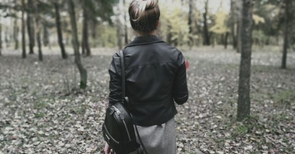 Solo Nature - Standing Woman Wearing Black Leather Jacket