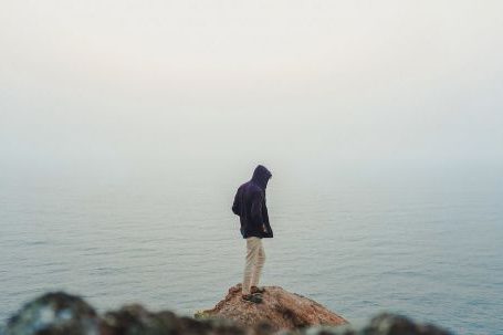 Solo Nature - Man Standing on Sea Cliff