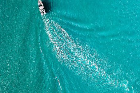 Yacht Travel - Drone view of yacht sailing in sea water