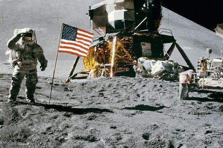 Exploration - Astronaut Standing Beside American Flag on the Moon